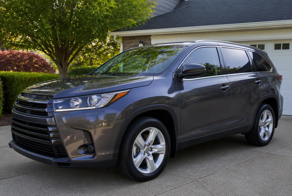 Freshly detailed gray SUV parked in a residential driveway